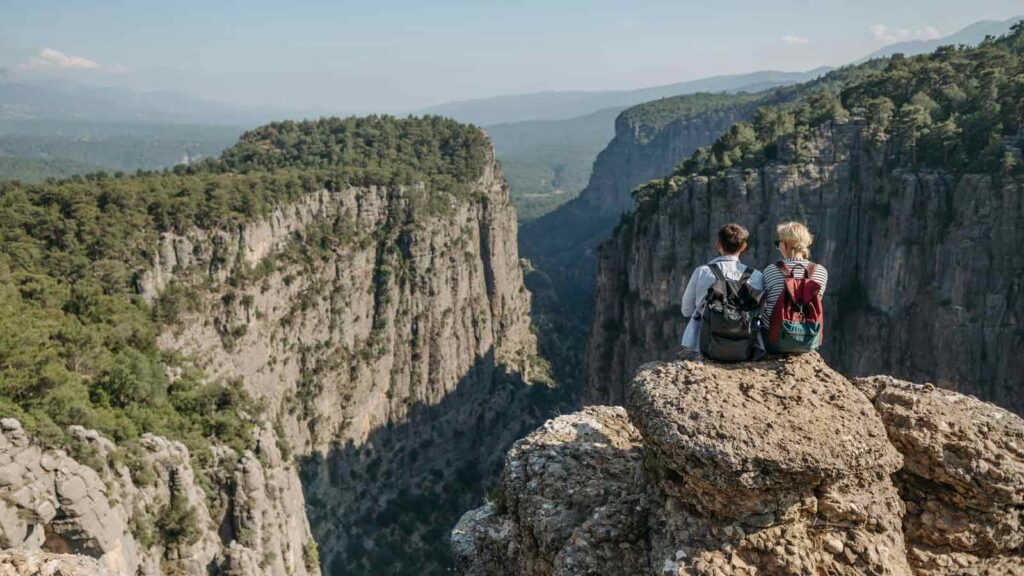 White-water rafting through Köprülü Canyon's emerald river surrounded by dramatic limestone cliffs and pine forests