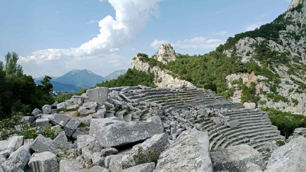 Termessos ancient theatre perched high in Taurus Mountains with dramatic cliff views and untouched stone ruins