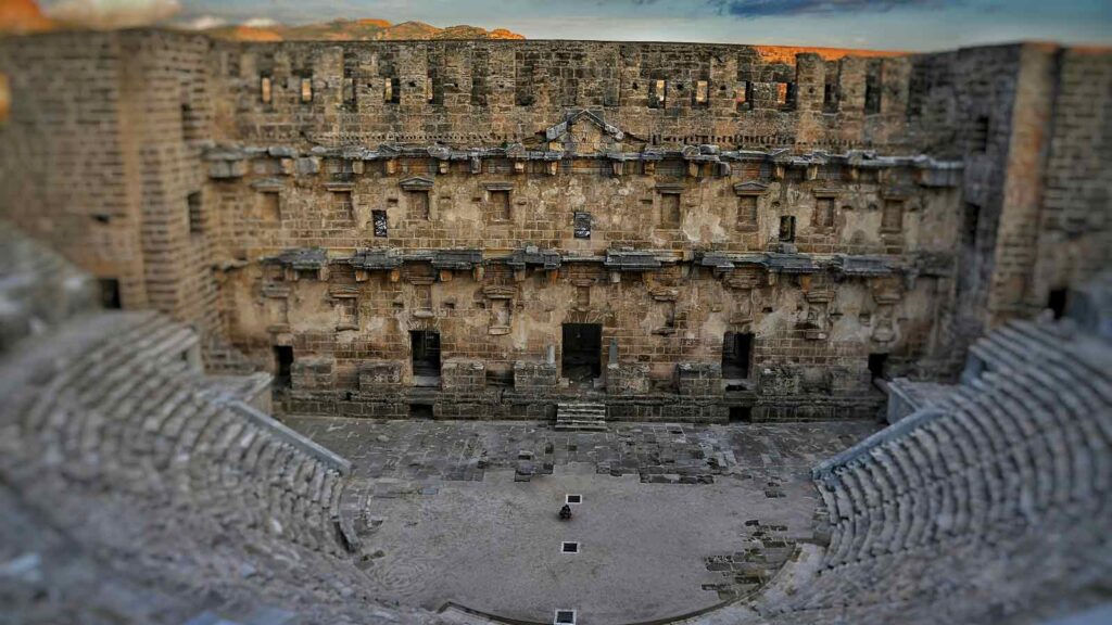 Aspendos ancient Roman theatre with perfectly preserved semi-circular seating and stage, one of world's best-preserved amphitheaters
