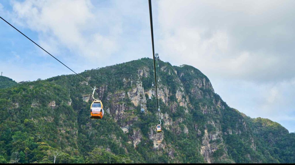 Olympos Teleferik cable car ascending Mount Tahtalı with panoramic Mediterranean coastline and Taurus Mountains vista