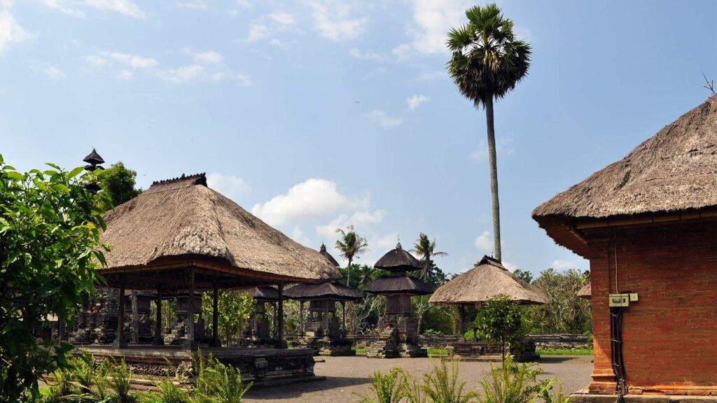 Indonesian rupiah banknotes and coins with ATM and credit card showing Bali currency information