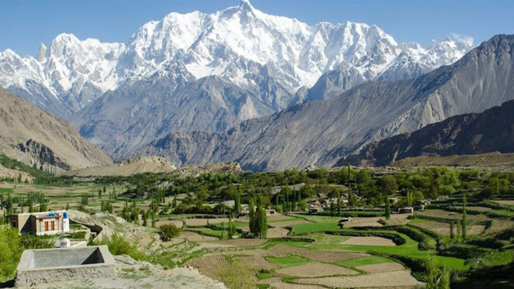 Pristine Hopar Valley showing glacier formations and traditional farming terraces in lesser-known Hunza destination