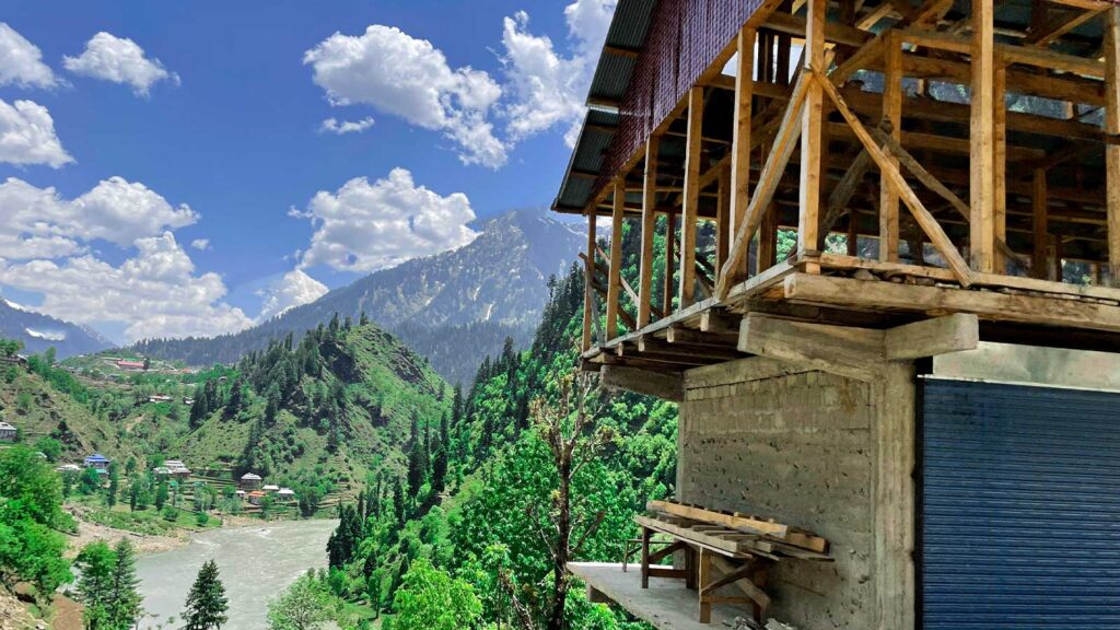 hunza Valley breathtaking scenery emerald fields snow-capped peaks pristine mountain beauty
