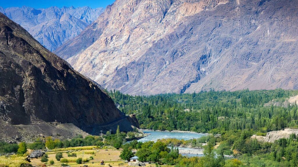 Hunza Valley panoramic view golden terraces green fields Rakaposhi peak backdrop


