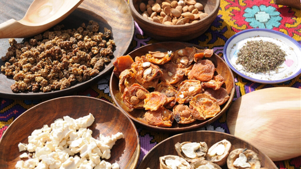 Traditional Hunza cuisine featuring chapshoro, thukpa, and other local dishes served in authentic setting