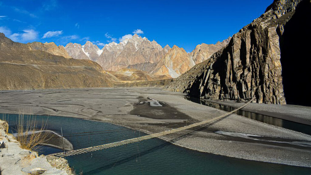 The infamous Hussaini Suspension Bridge with missing planks spanning Hunza River for extreme adventure seekers