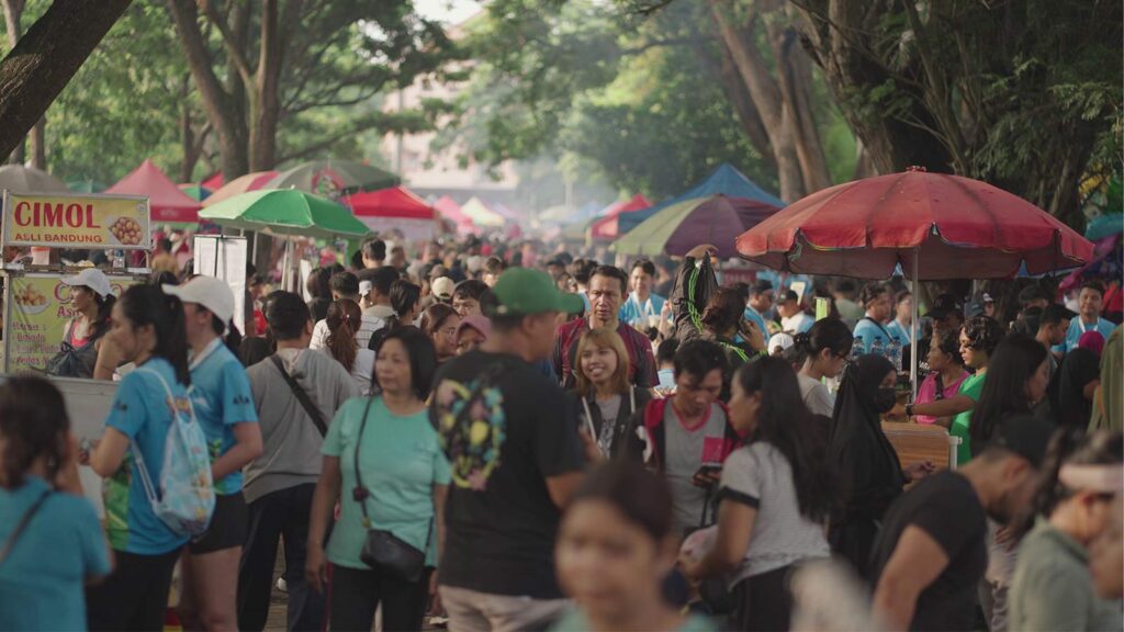 Bustling traditional Balinese market with vendors selling handicrafts, textiles, and authentic souvenirs