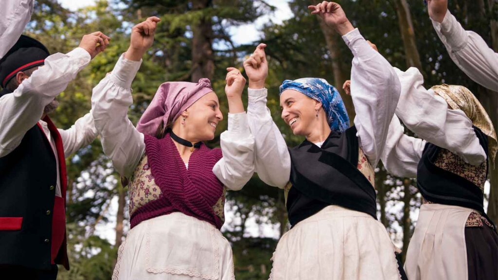 Visitors in modest clothing entering mosque following proper dress code requirements